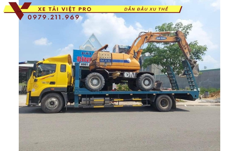 Xe tải Auman C160 nâng đầu chở máy công trình giá bao nhiêu?