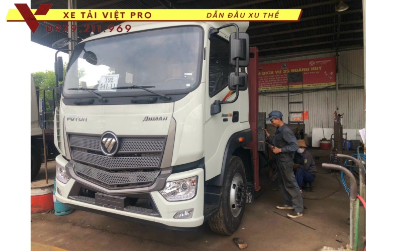 Xe tải Auman C160 nâng đầu chở máy công trình giá bao nhiêu?