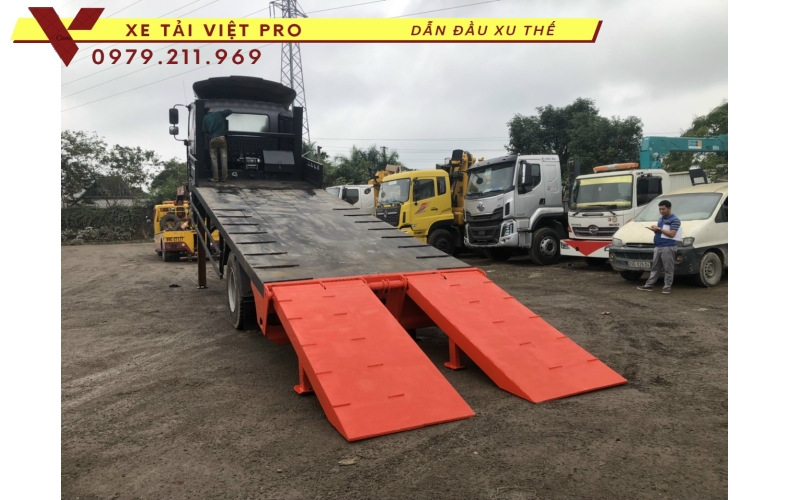 Xe tải Auman C160 nâng đầu chở máy công trình giá bao nhiêu?