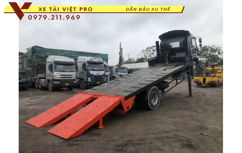 Xe tải Auman C160 nâng đầu chở máy công trình giá bao nhiêu?