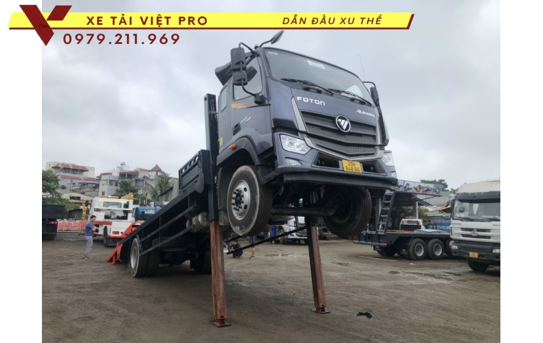 Xe tải Auman C160 nâng đầu chở máy công trình giá bao nhiêu?