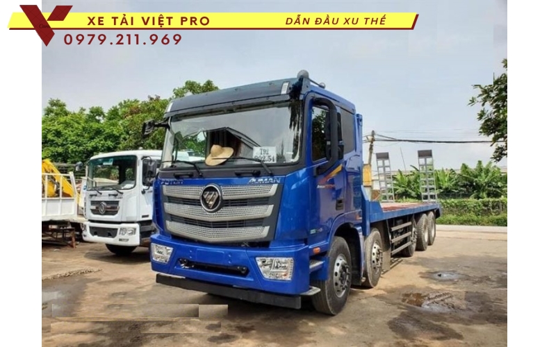 Xe Auman 4 chân nâng đầu chở máy công trình